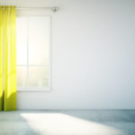 Blank white wall yellow curtain