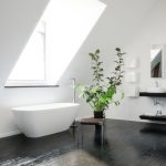 Modern stylish black and white attic bathroom
