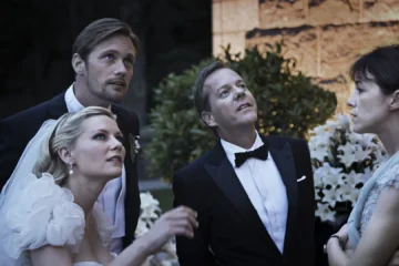 Justine, Michael, John et Claire pendant le mariage dans Melancholia